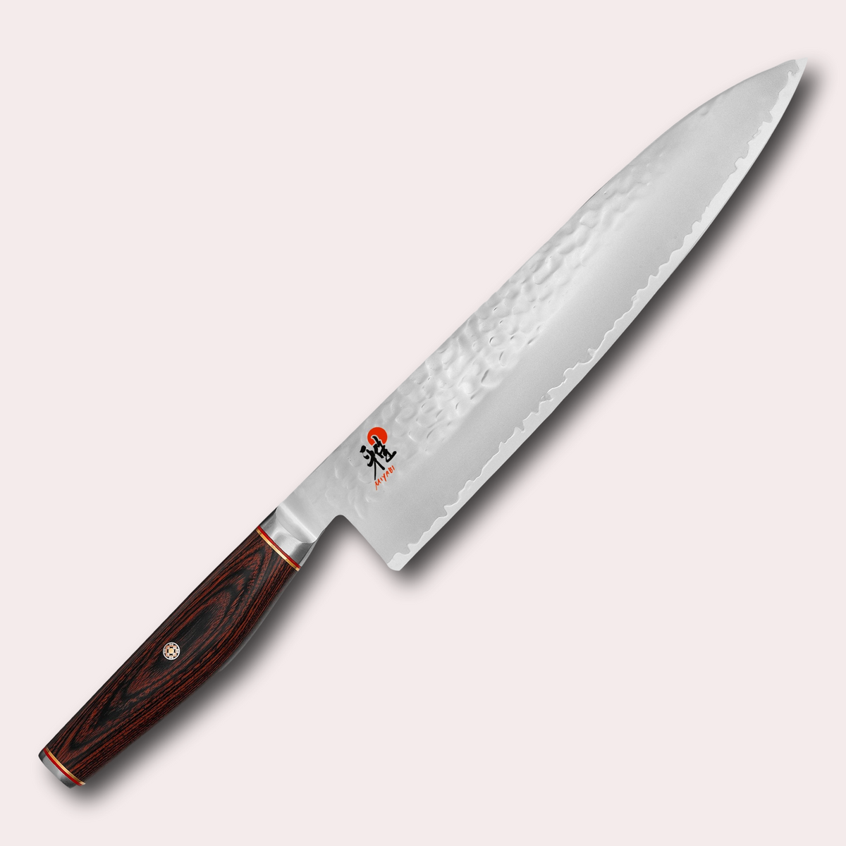 Miyabi 6000MCT 24cm Gyuto chefs knife. 3 layer steel blade with hammered finish, and decorative brown pakkawood handle. Supplied by japanese-knives.co.uk