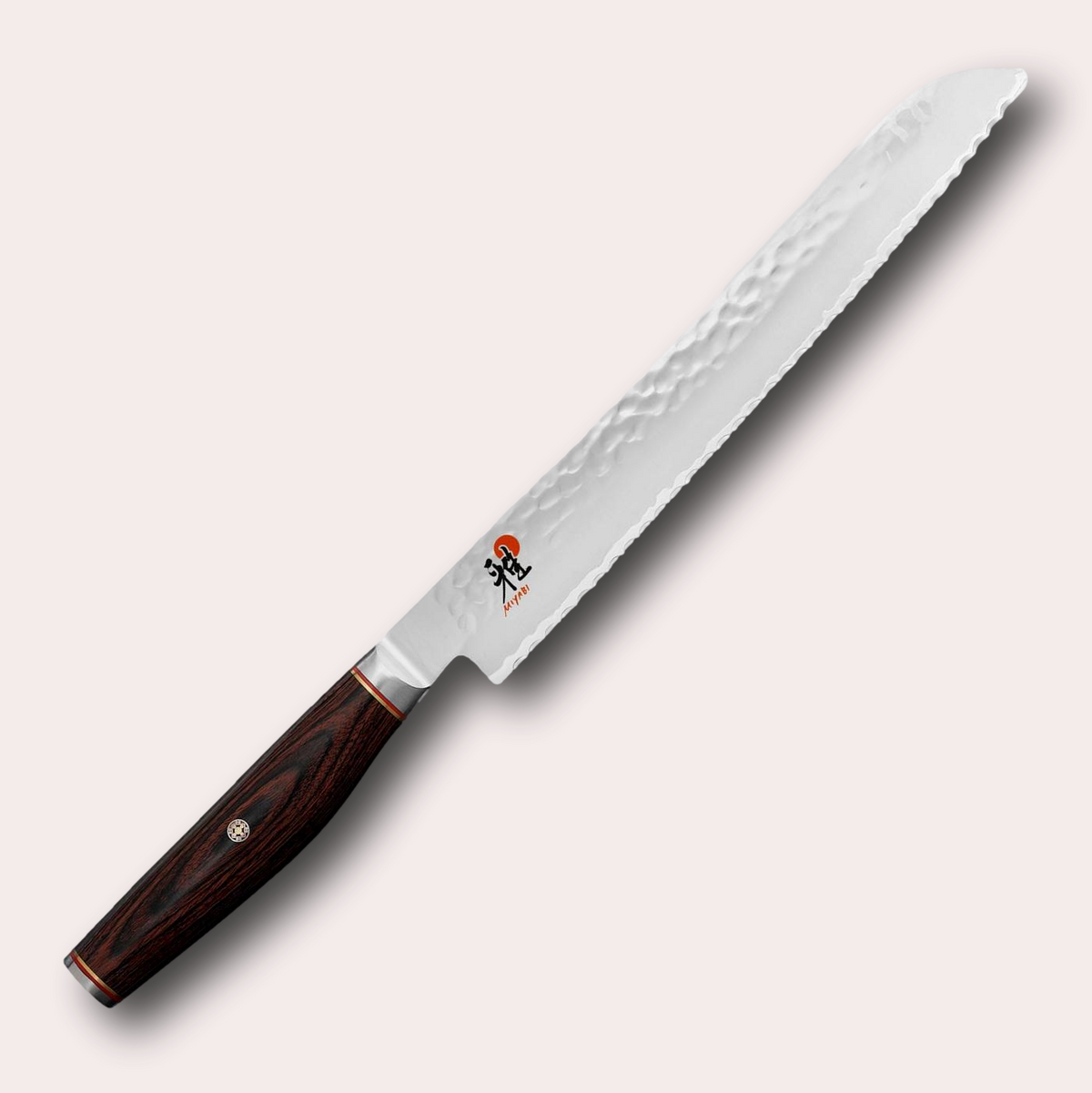 Miyabi 6000MCT 23cm Bread slicing knife. 3 layer steel blade with hammered finish, and decorative brown pakkawood handle. Supplied by japanese-knives.co.uk