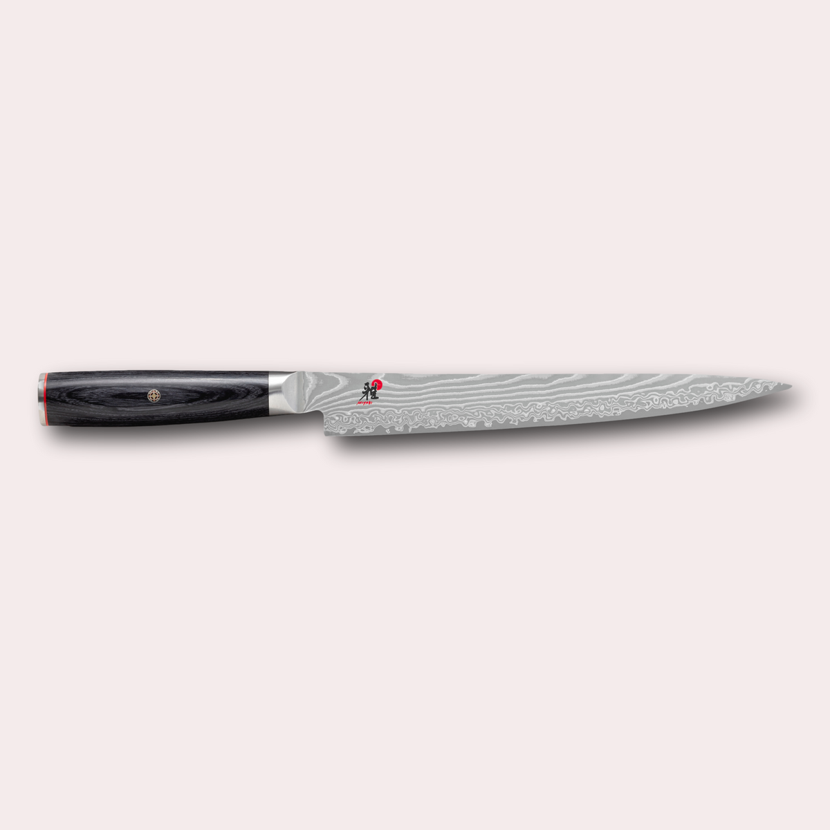 Miyabi 5000FCD Sujihiki slicing knife. Damascus blade and black pakkawood handle with decorative through-pins. japanese-knives.co.uk