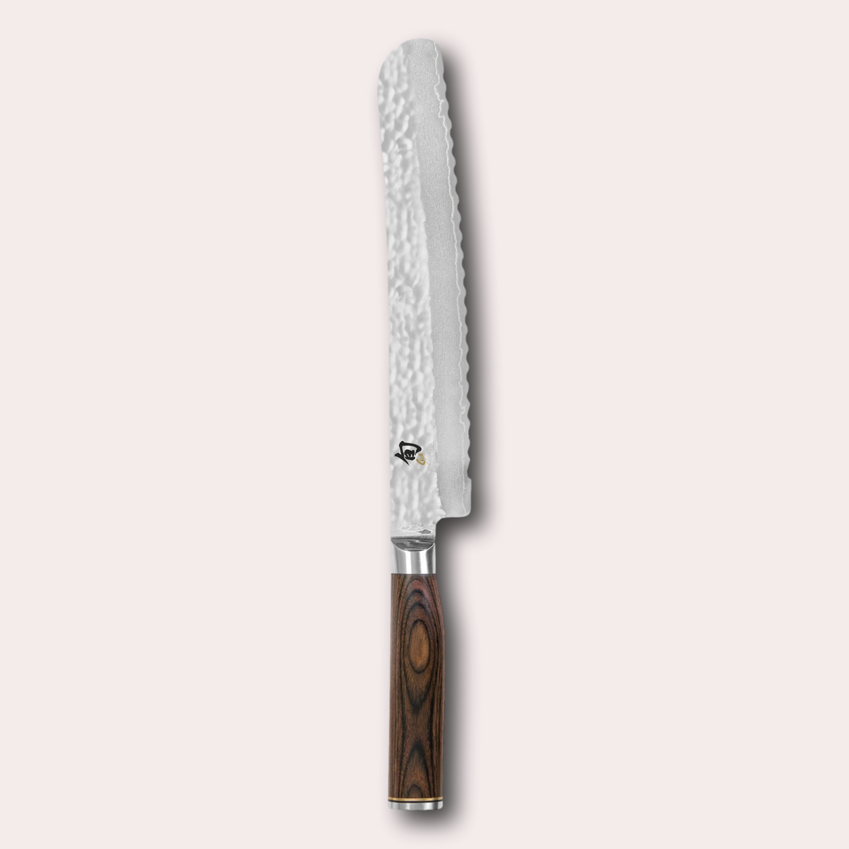 Kai Shun Premier bread knife. VG max blade wrapped in 32 layers of Damascus steel with a hammered finish, and brown pakkawood handle. japanese-knives.co.uk