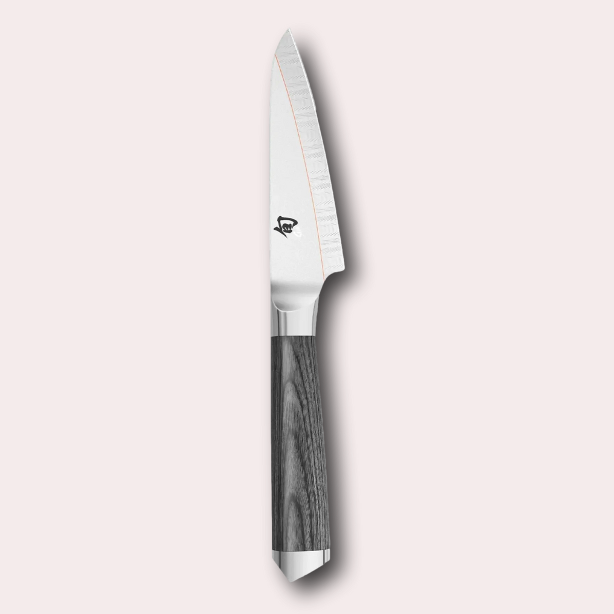 Kai Shun Kagerou paring knife. 2 part blade of polished and dual-core Damascus Steel with a copper flash line. Mottled grey pakkawood handle complete with a Shun logo end cap.