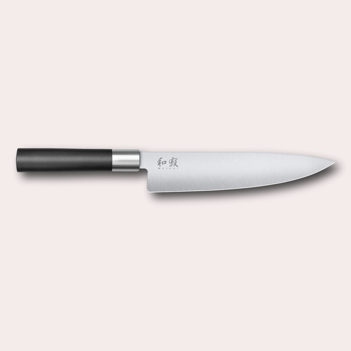 Kai Wasabi Black Chef knife. Corrosion-resistant 6A/1K6 steel, matte black oval shaped plastic handle.