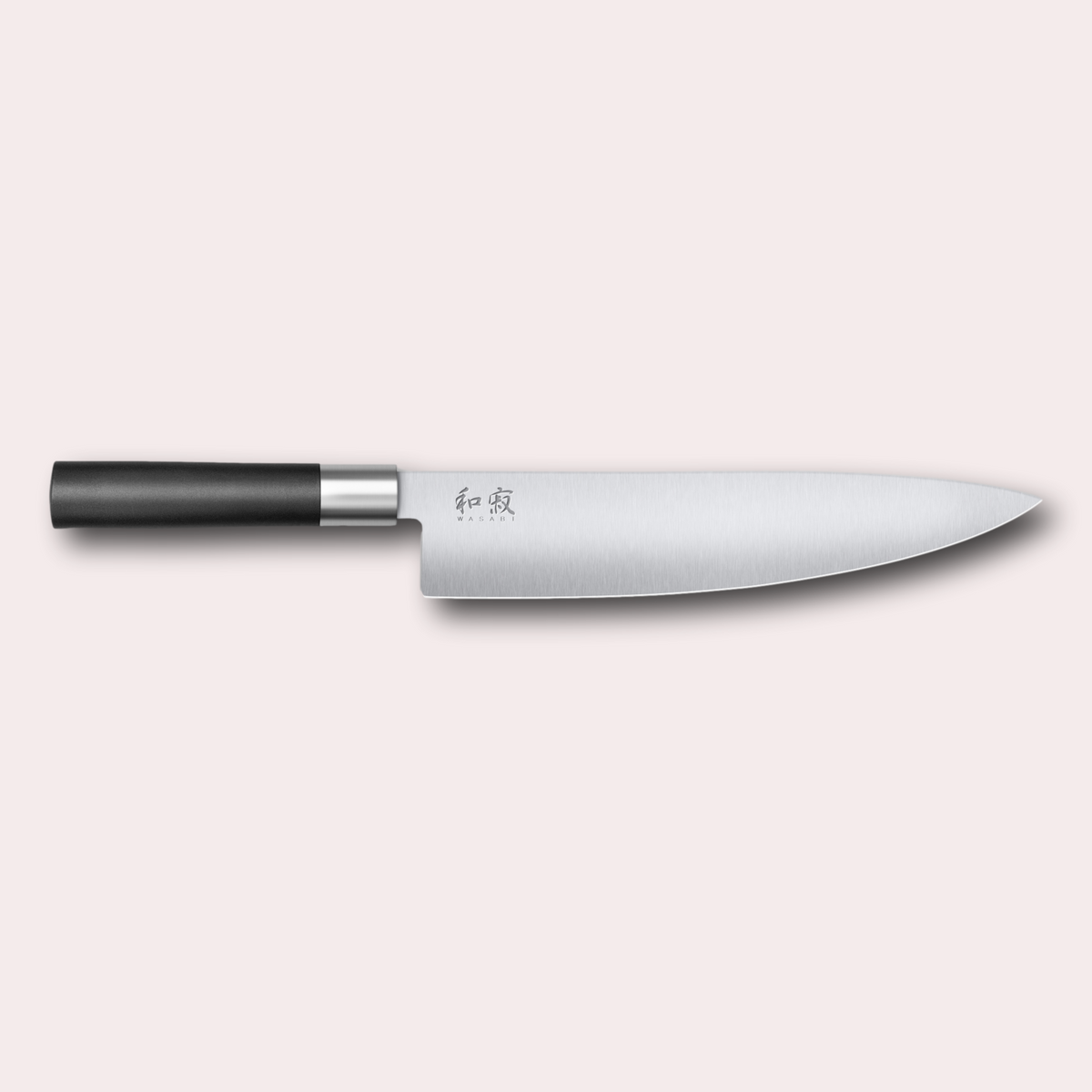 Kai Wasabi Black Chef knife. Corrosion-resistant 6A/1K6 steel, matte black oval shaped plastic handle.