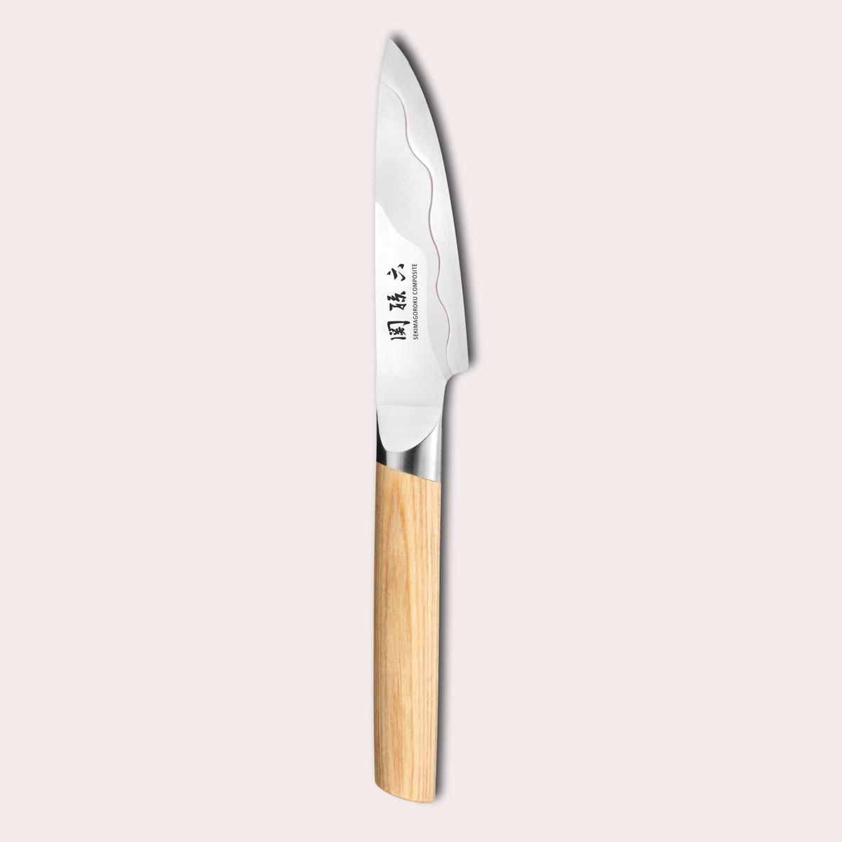 Kai Seki Magoroku Composite knife. Natural wood handle with the two grades of blade metal separated by a beautiful copper flash.