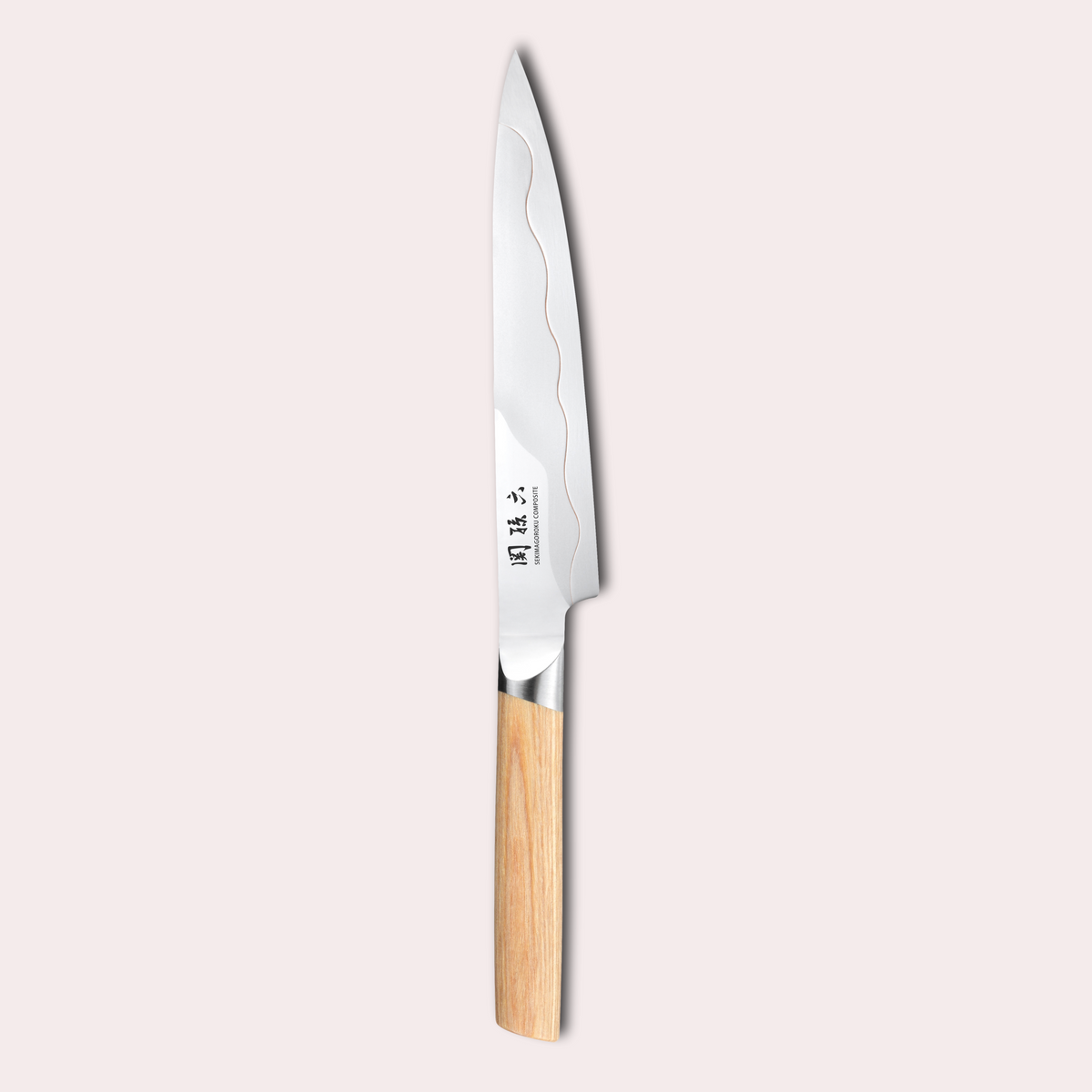 Kai Seki Magoroku Composite knife. Natural wood handle with the two grades of blade metal separated by a beautiful copper flash.