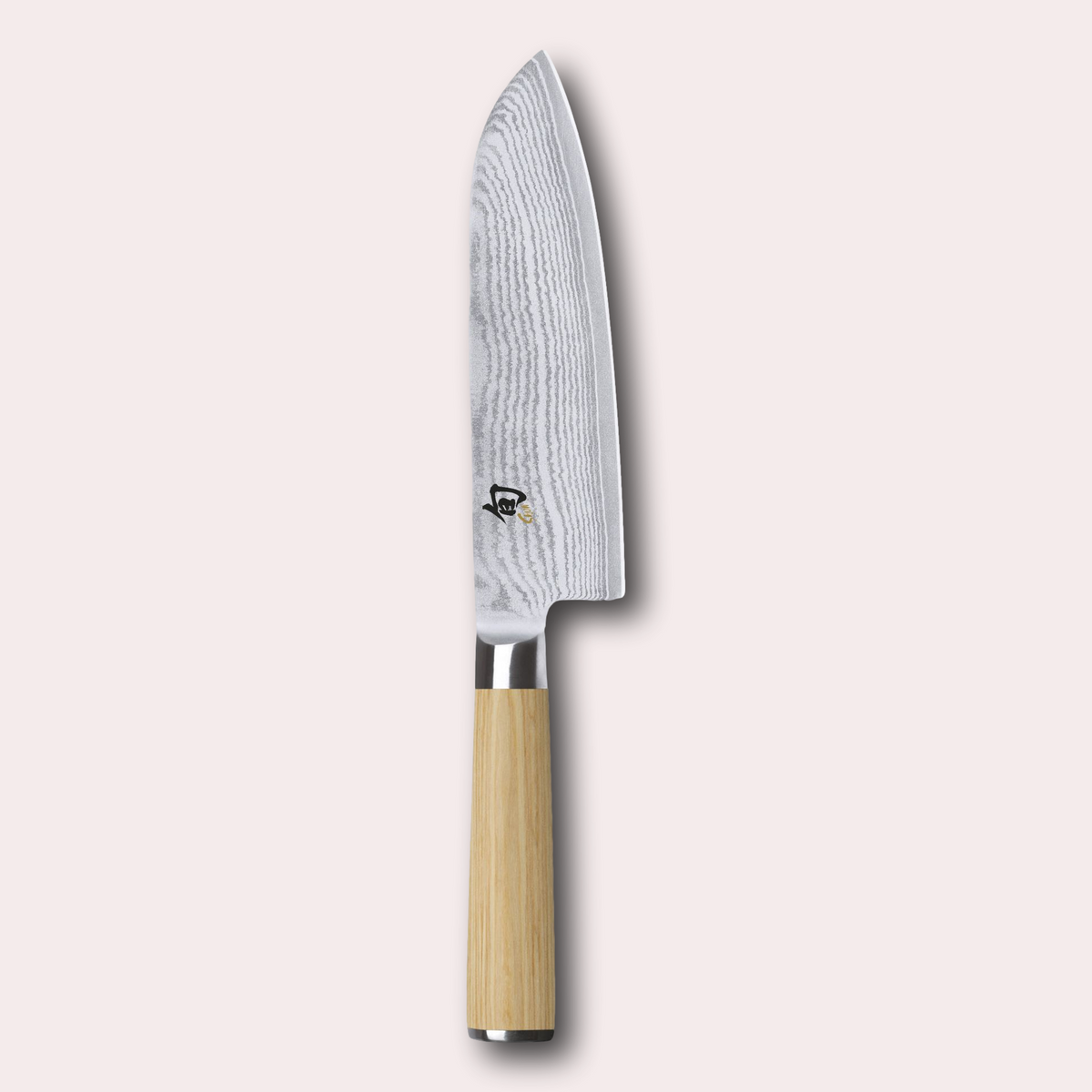 Kai Shun White 18cm Santoku knife. Light ash coloured pakkawood handle, meets a VG Max steel core blade wrapped in 32 layers of Damascus Steel.