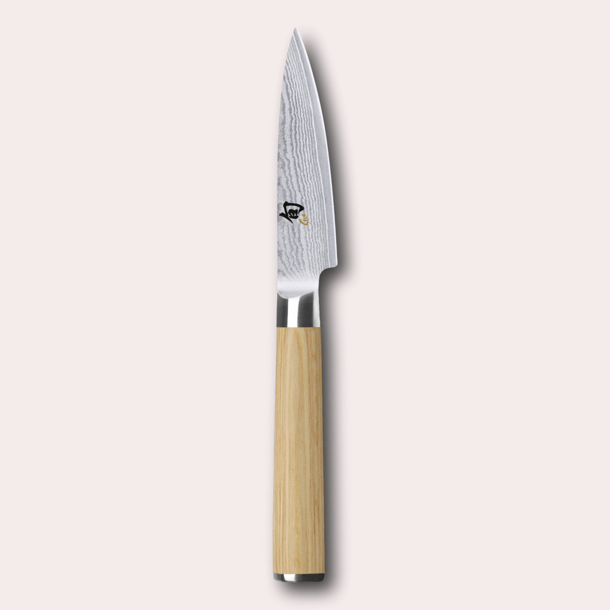 Kai Shun White paring knife. light ash coloured pakkawood handle, meets a VG Max steel core blade wrapped in 32 layers of Damascus Steel.
