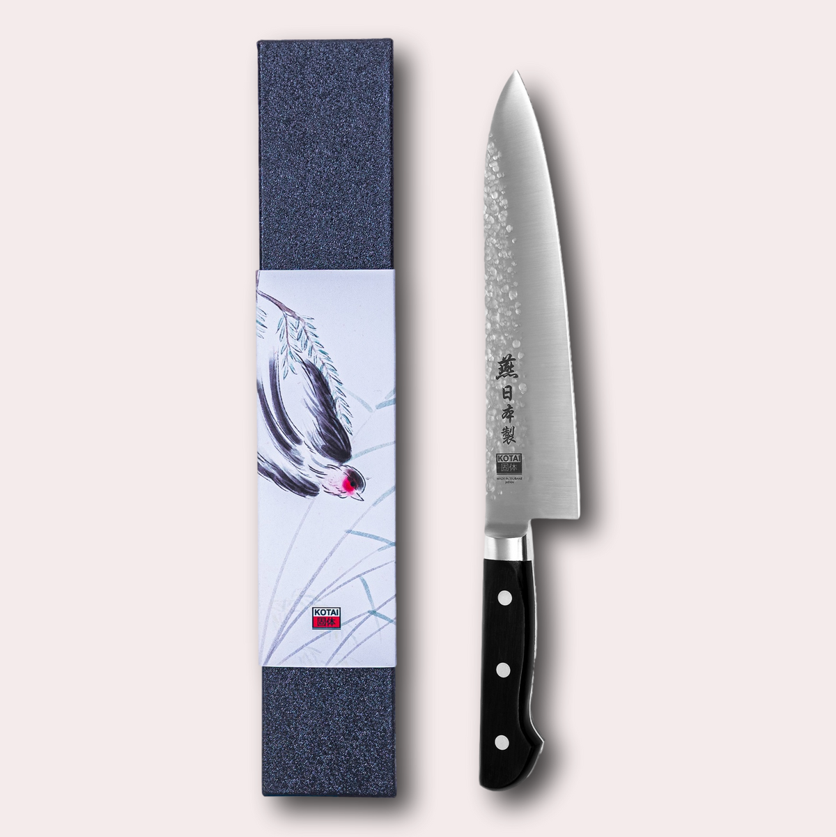 Kotai Tsubame gyuto knife with damascus blade and ergonomic handle