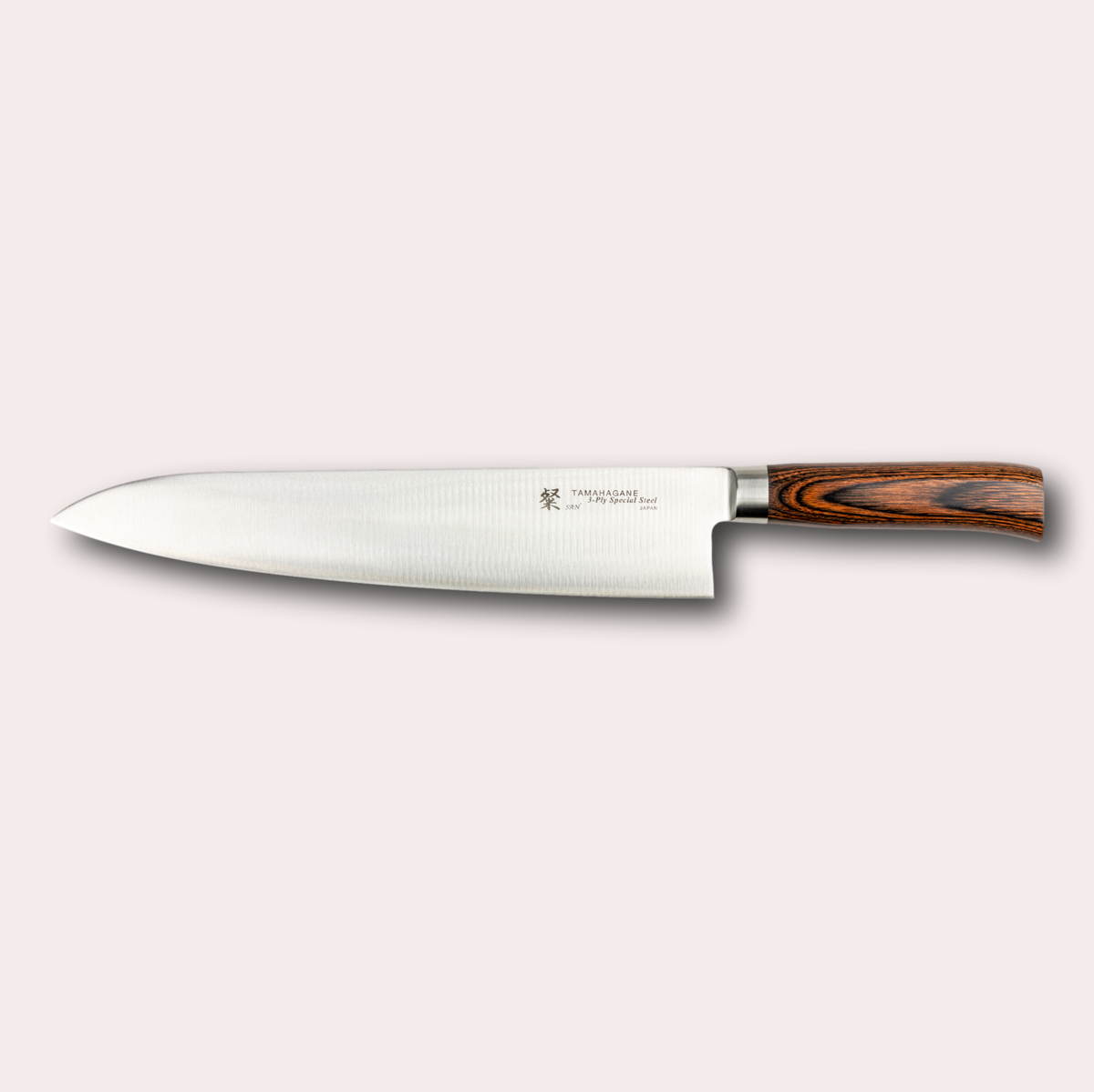 Tamahagane San 27cm chef knife, with 3 ply special steel blade, and brown micarta handle. Sold by japanese-knives.co.uk