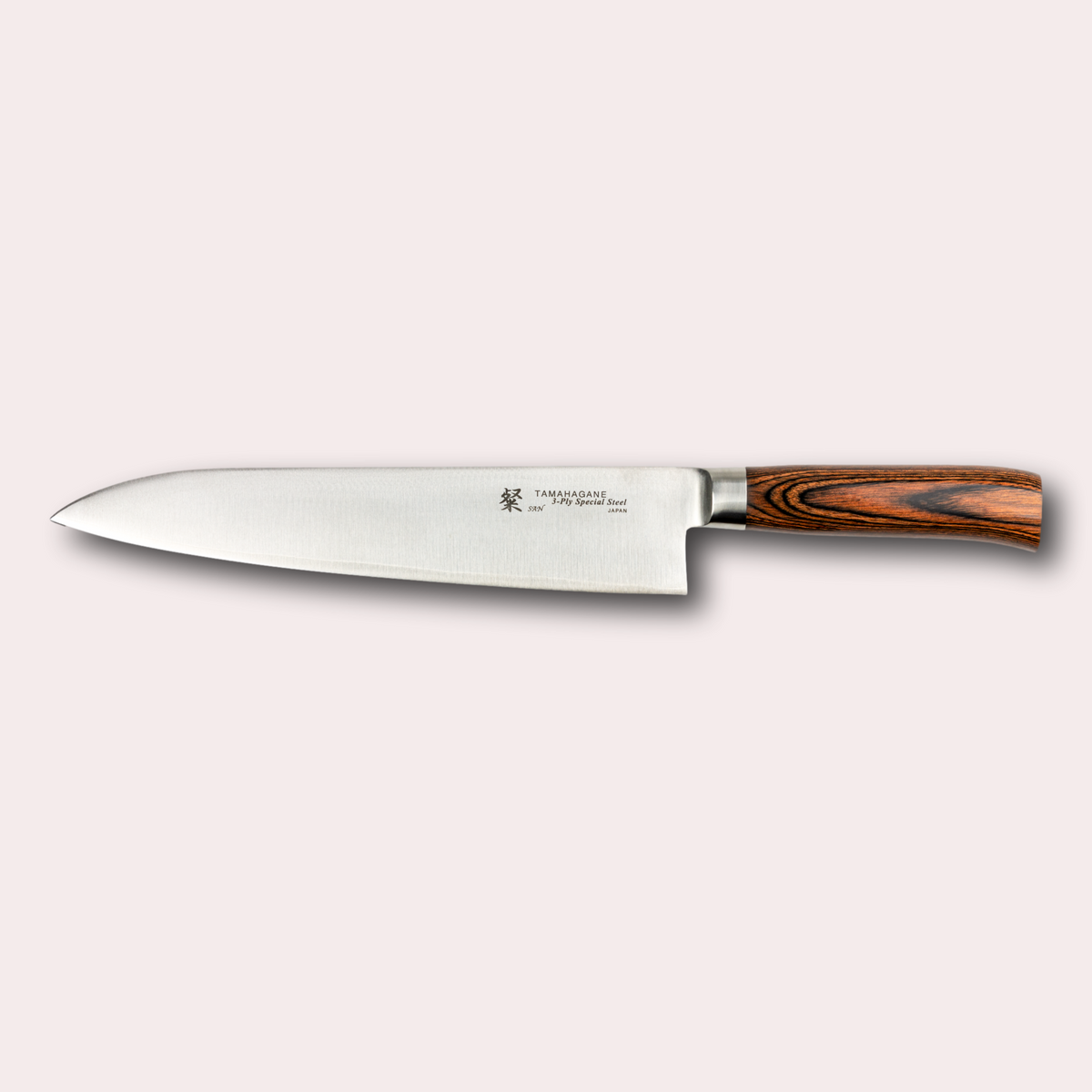 Tamahagane San 24cm chef knife, with 3 ply special steel blade, and brown micarta handle. Sold by japanese-knives.co.uk