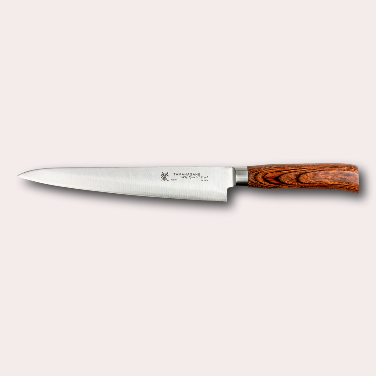 Tamahagane San carving knife, with 3 ply special steel blade, and brown micarta handle. Sold by japanese-knives.co.uk