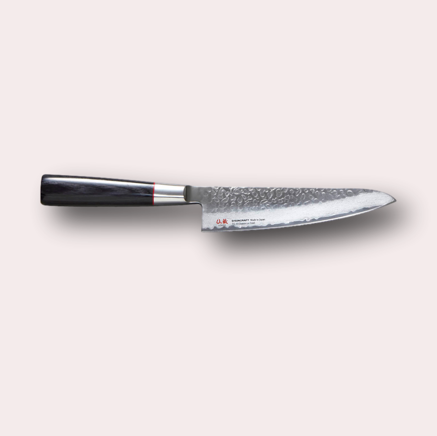 Suncraft Senzo Santoku knife with VG10 hammered finish blade, and black pakkawood handle.