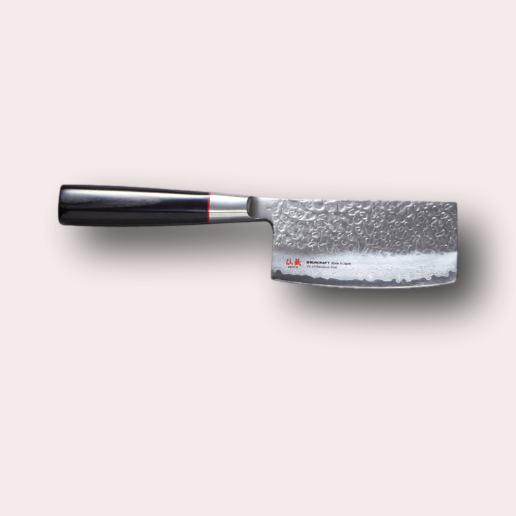 Suncraft Senzo Nakiri knife with VG10 hammered finish blade, and black pakkawood handle.