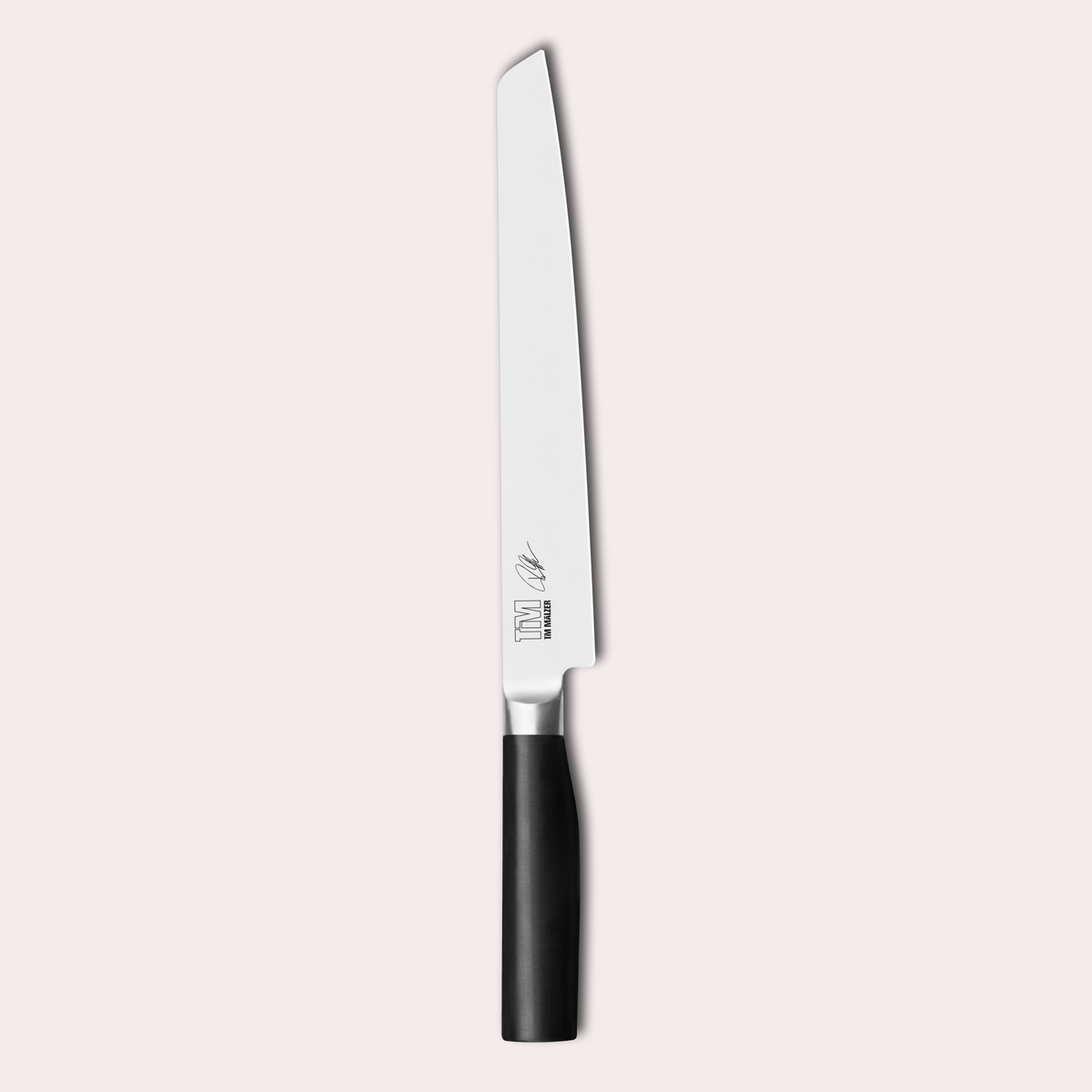 Tim Malzer designed Kai Kamagata slicing knife. 4116 steel blade and POM handles. japanese-knives.co.uk