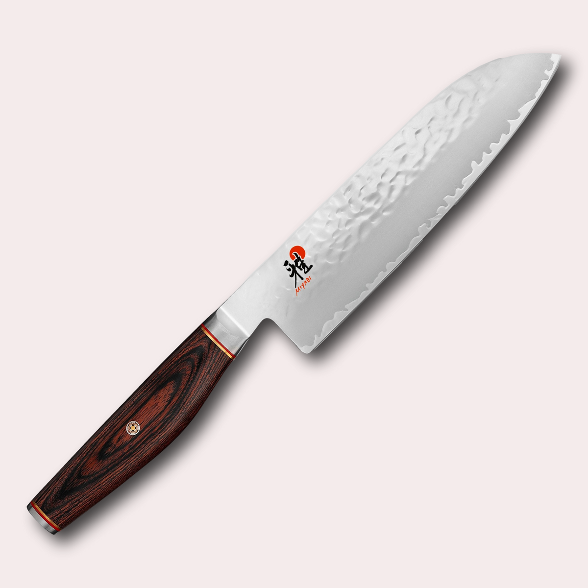 Miyabi 6000MCT 18cm Santoku slicing knife. 3 layer steel blade with hammered finish, and decorative brown pakkawood handle. Supplied by japanese-knives.co.uk