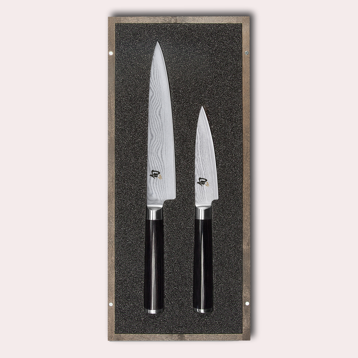 KAI Shun 2 piece set, utility and paring knives. Damascus blade with razor sharp edge and black pakkawood handle. 