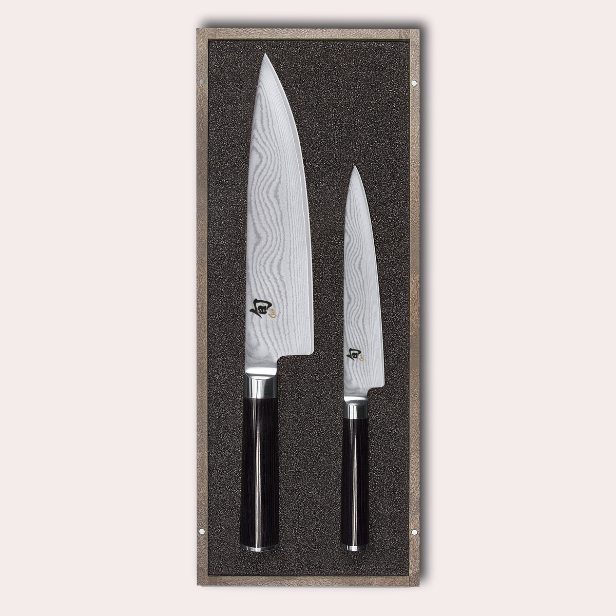 KAI Shun 2 piece set, chef and utility knives. Damascus blade with razor sharp edge and black pakkawood handle. 