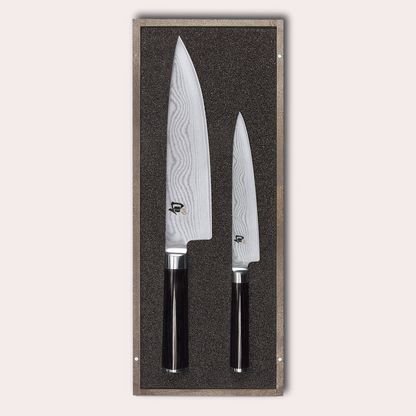 KAI Shun 2 piece set, chef and utility knives. Damascus blade with razor sharp edge and black pakkawood handle. 