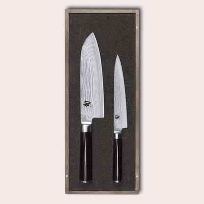 KAI Shun 2 piece set, santoku and utility knives. Damascus blade with razor sharp edge and black pakkawood handle. 