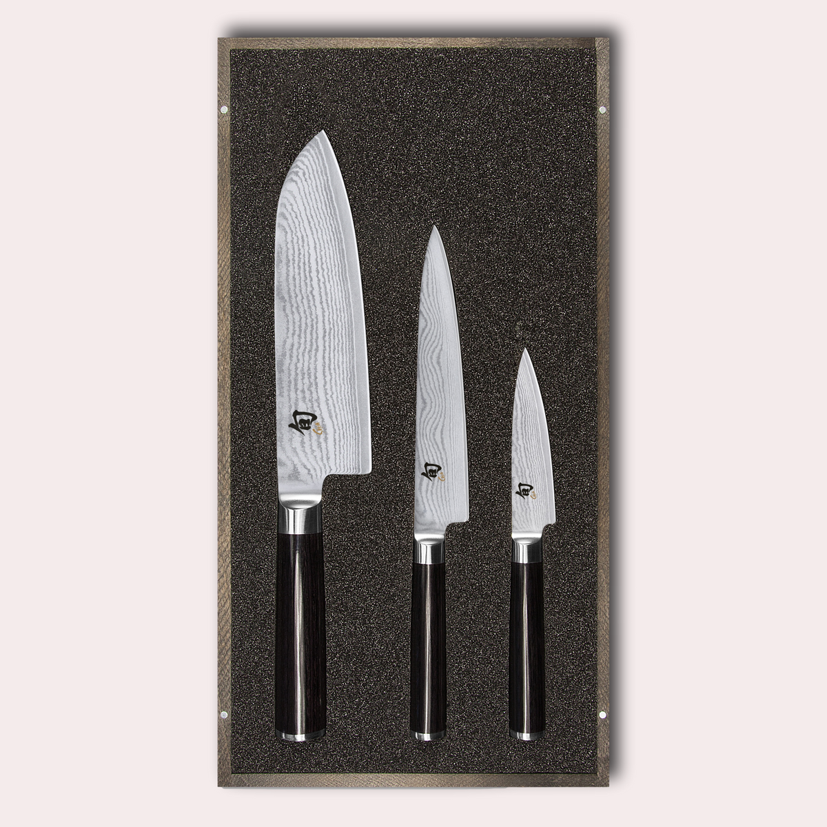 KAI Shun 3 piece set, santoku, utility and paring knives. Damascus blade with razor sharp edge and black pakkawood handle. 