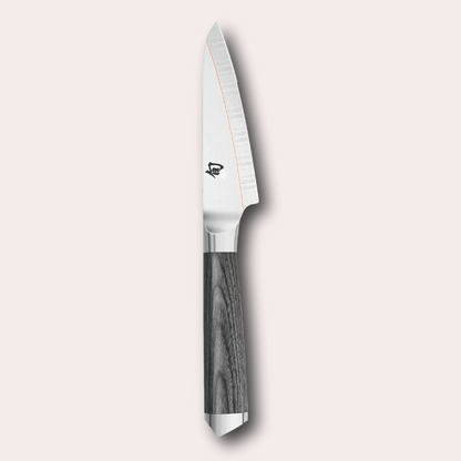 Kai Shun Kagerou paring knife. 2 part blade of polished and dual-core Damascus Steel with a copper flash line.  Mottled grey pakkawood handle complete with a Shun logo end cap.