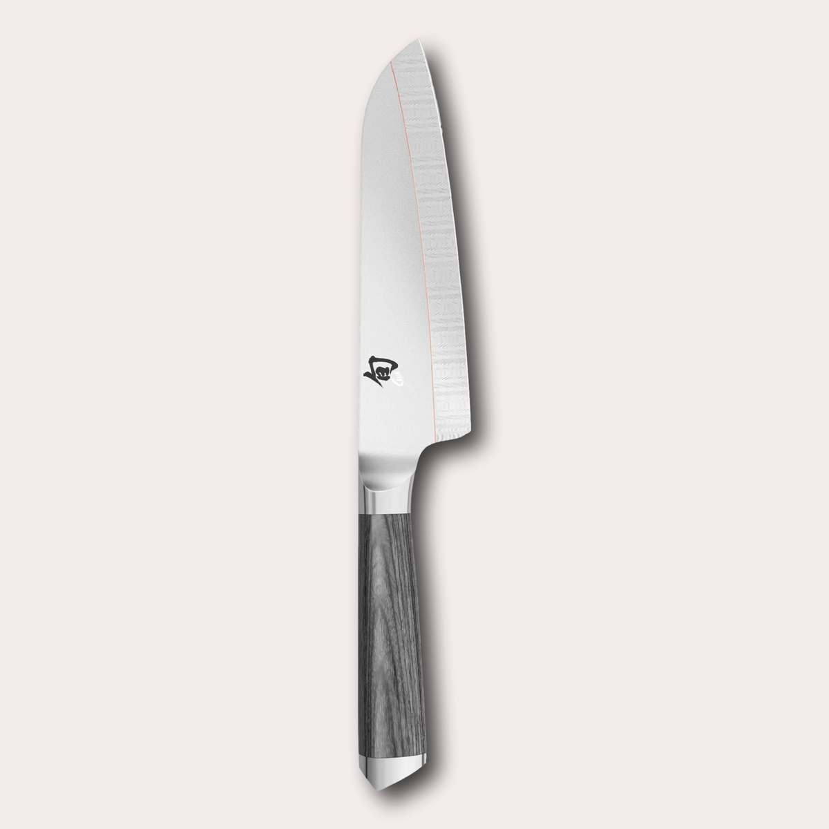Kai Shun Kagerou Santoku knife. 2 part blade of polished and dual-core Damascus Steel with a copper flash line.  Mottled grey pakkawood handle complete with a Shun logo end cap.