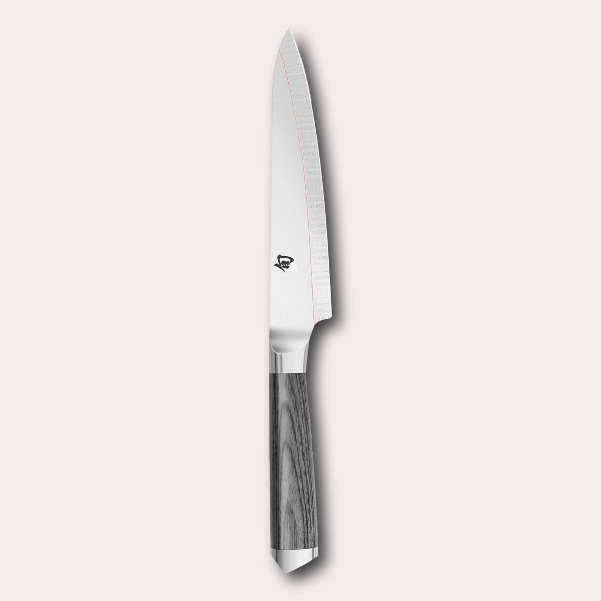 Kai Shun Kagerou utility knife. 2 part blade of polished and dual-core Damascus Steel with a copper flash line.  Mottled grey pakkawood handle complete with a Shun logo end cap.