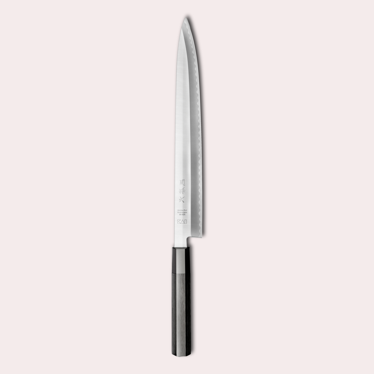Kai Sekimagoroku KK Yanagiba knife. Long 8A steel blade, single bevel with black pakkawood handle.