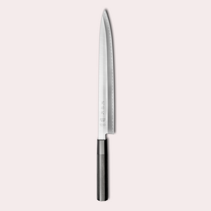 Kai Sekimagoroku KK Yanagiba knife. Long 8A steel blade, single bevel with black pakkawood handle.