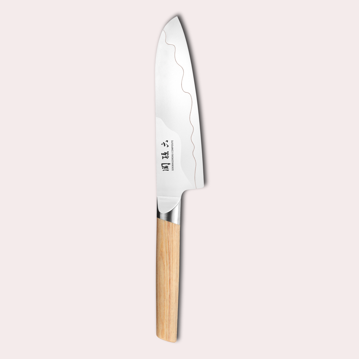 Kai Seki Magoroku Composite knife. Natural wood handle with the two grades of blade metal separated by a beautiful copper flash.