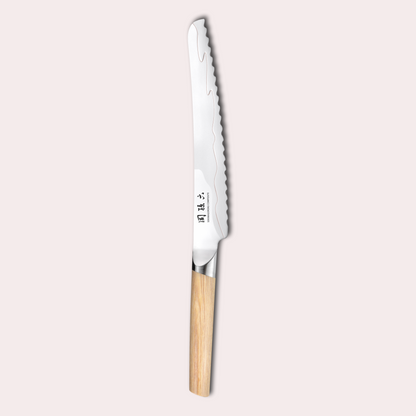Kai Seki Magoroku Composite bread knife. Natural wood handle with the two grades of blade metal separated by a beautiful copper flash.