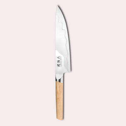 Kai Seki Magoroku Composite chef  knife. Natural wood handle with the two grades of blade metal separated by a beautiful copper flash.