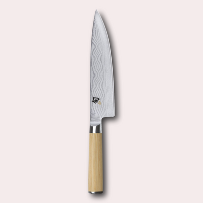 Kai Shun White 20cm chef knife.  Light ash coloured pakkawood handle, meets a VG Max steel core blade wrapped in 32 layers of Damascus Steel.
