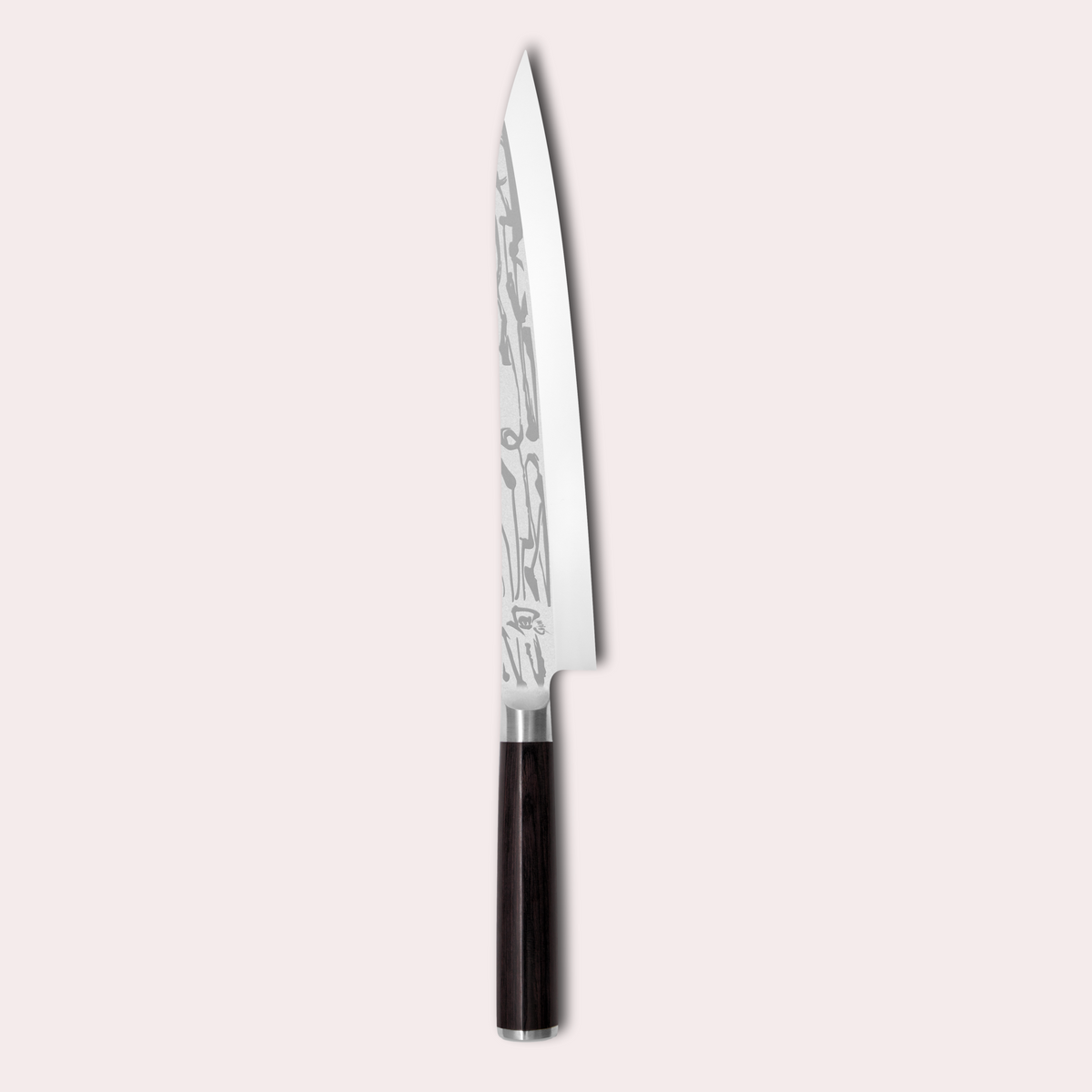 Kai Shun Pro Sho slicing knife. VG10 steel honed on one side only. Decorative blade design and black pakkawood handle. japanese-knives.co.uk