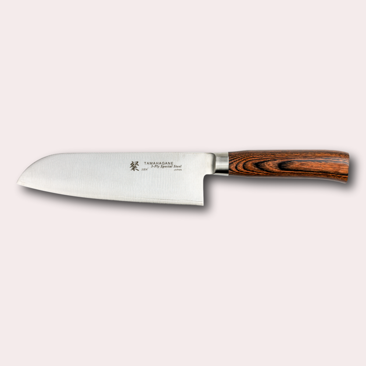 Tamahagane San Santoku knife, with 3 ply special steel blade, and brown micarta handle.  Sold by japanese-knives.co.uk