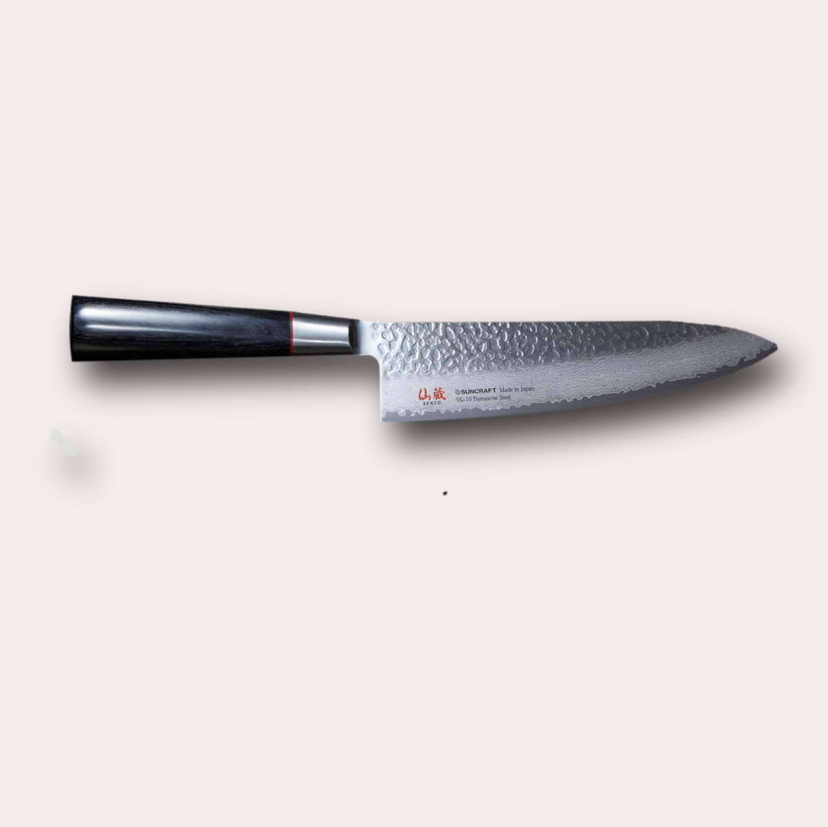 Suncraft Senzo Gyuto chefs knife with VG10 hammered finish blade, and black pakkawood handle.