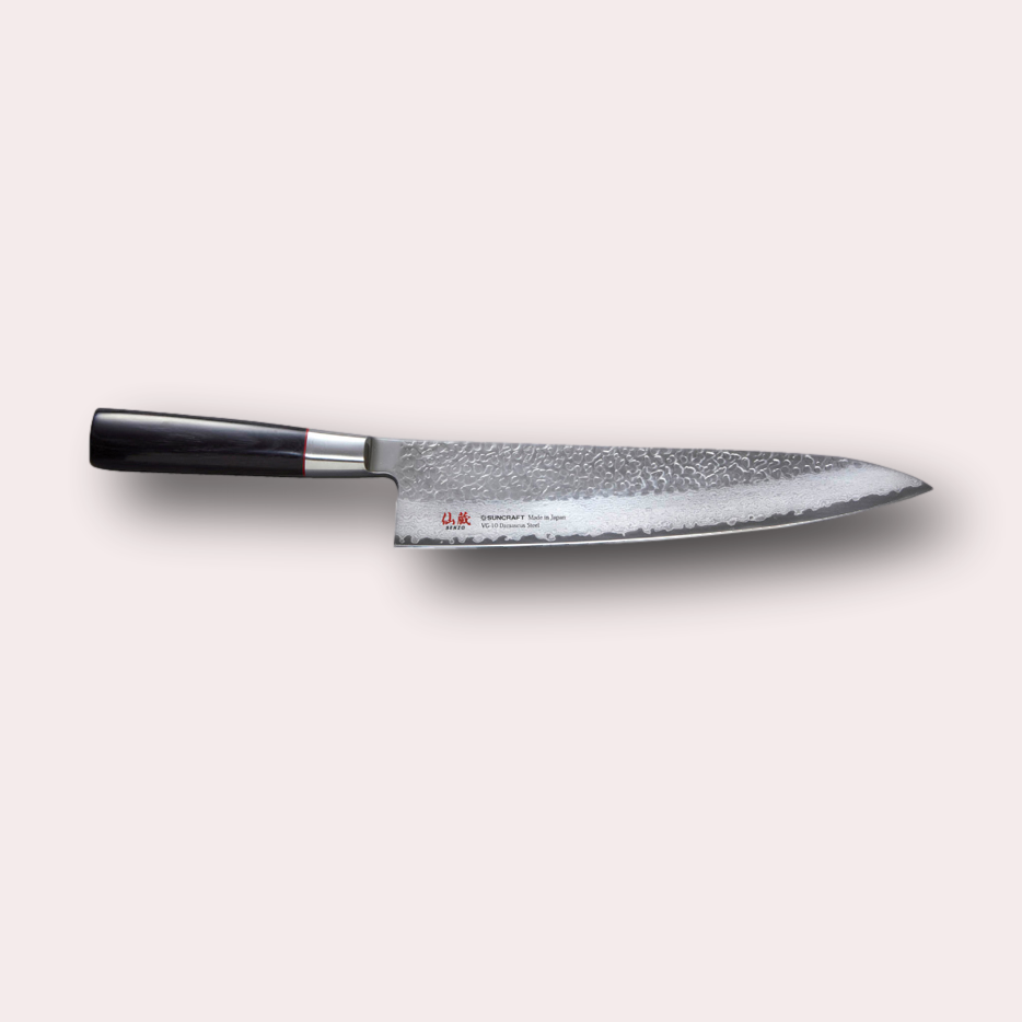 Suncraft Senzo Gyuto chefs knife with VG10 hammered finish blade, and black pakkawood handle.