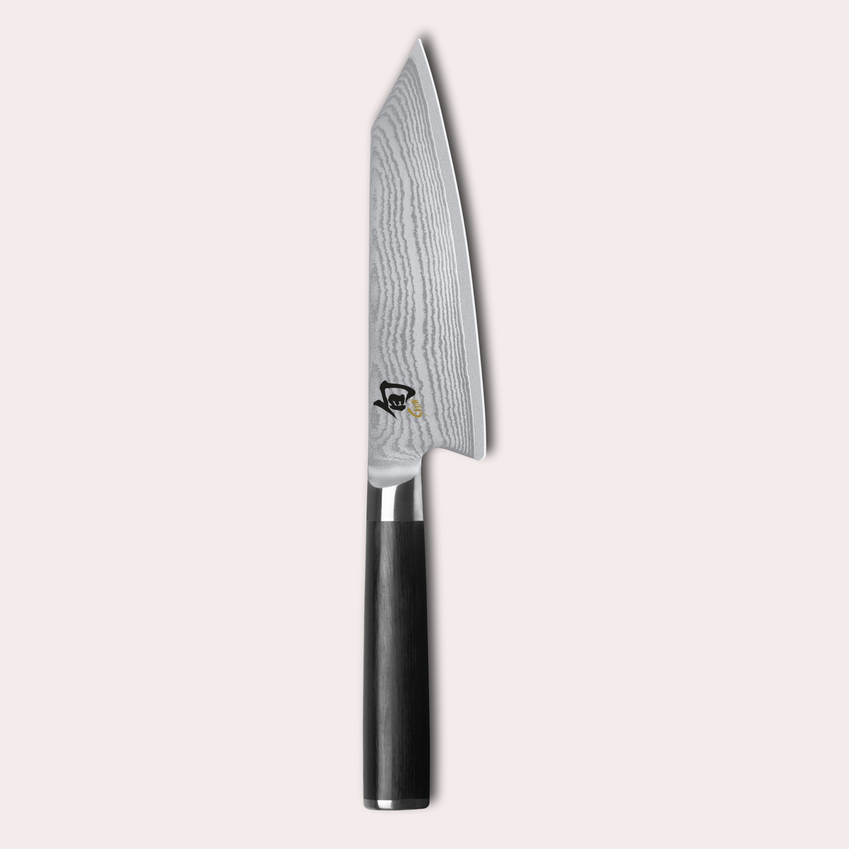 KAI Shun classic kiritsuke knife. Damascus blade with razor sharp edge and black pakkawood handle. 