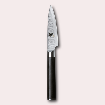KAI Shun 9cm paring knife.  Damascus blade with razor sharp edge and black pakkawood handle. 