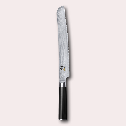 KAI Shun 23cm Bread Knife , damascus blade with razor sharp edge and black pakkawood handle. 
