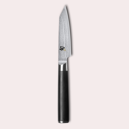 KAI Shun classic kiritsuke knife. Damascus blade with razor sharp edge and black pakkawood handle. 